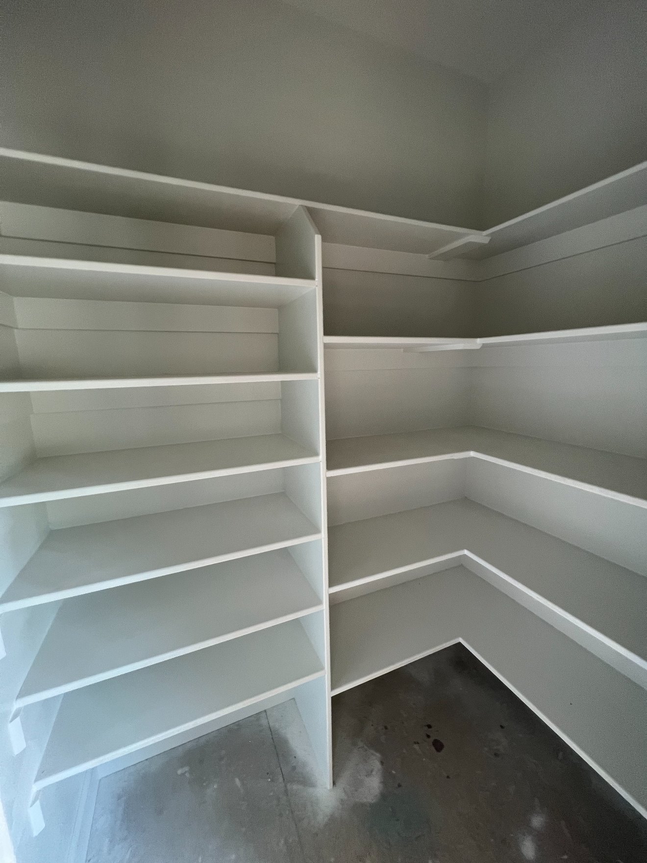Custom walk-in pantry with built-in adjustable shelving