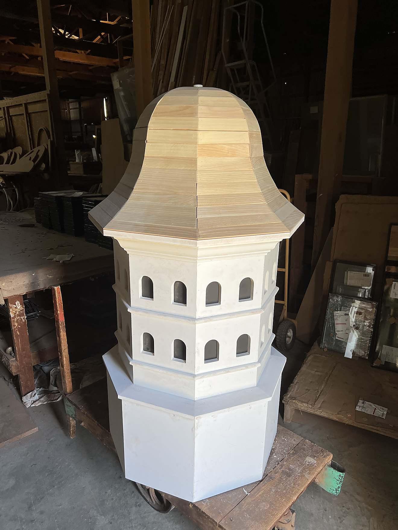 Custom handcrafted wood cupola with louvered panels and a finial cap