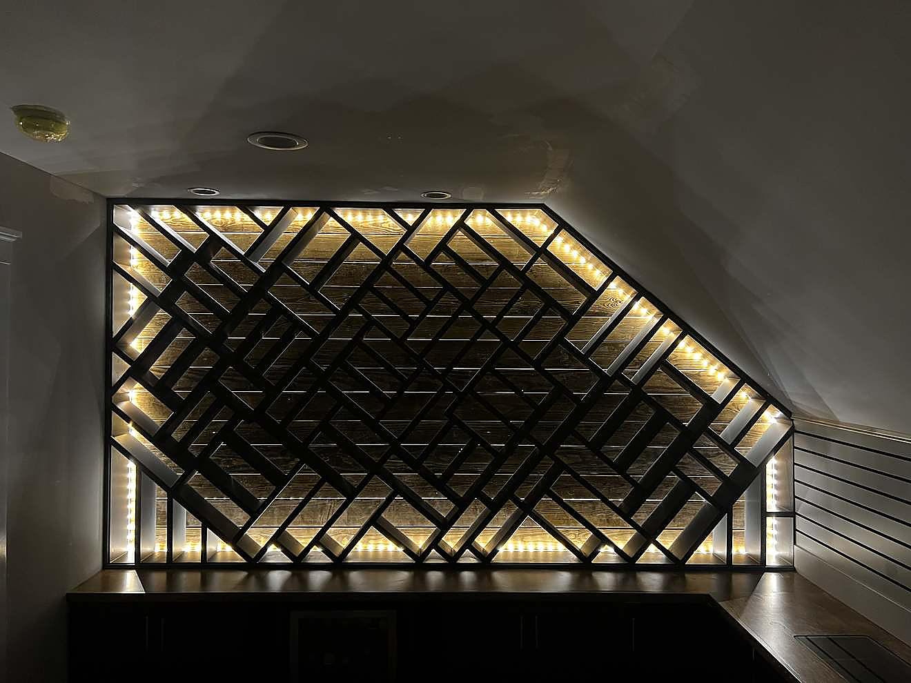 Custom geometric wood lattice accent wall with integrated LED lighting