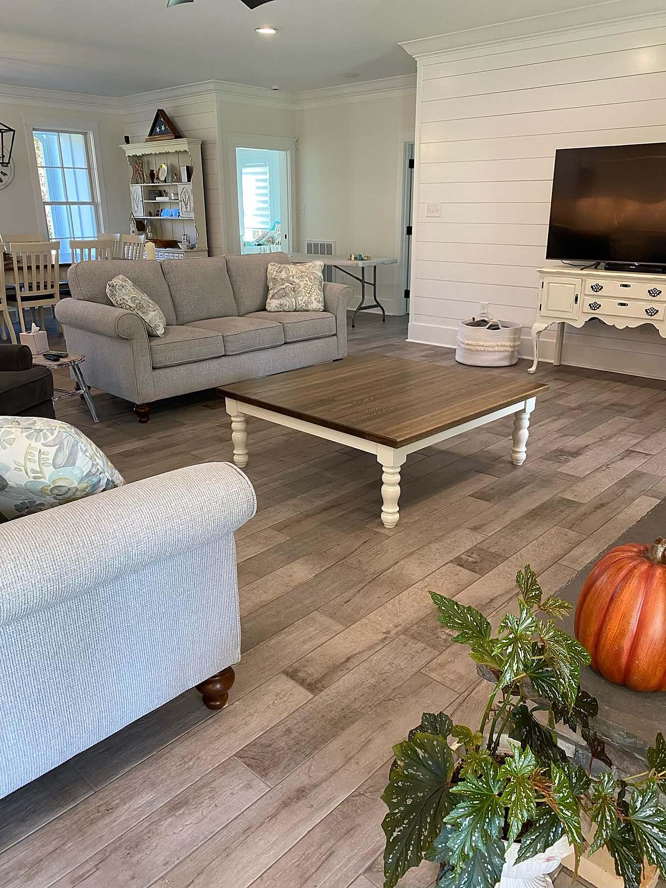 Finished living room with a shiplap accent wall